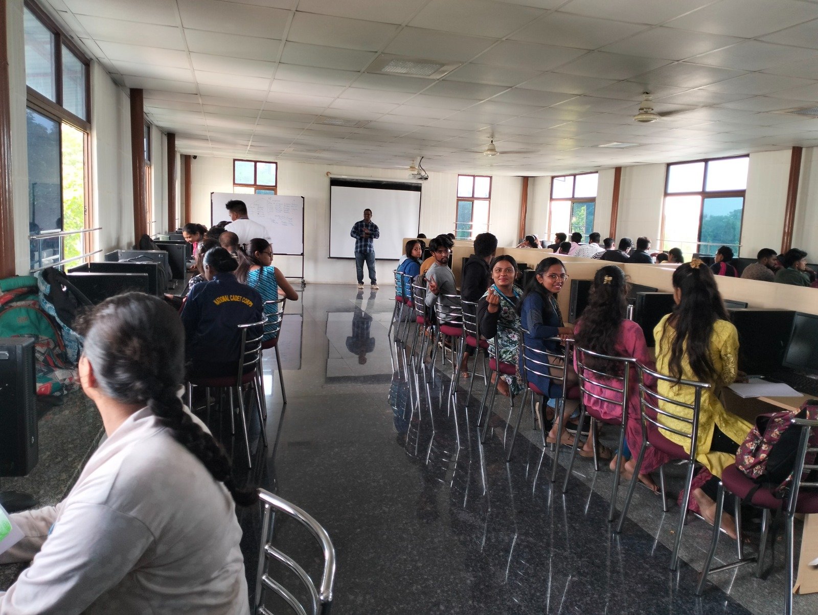 A full lab of students in a live QA Career Pro classroom session